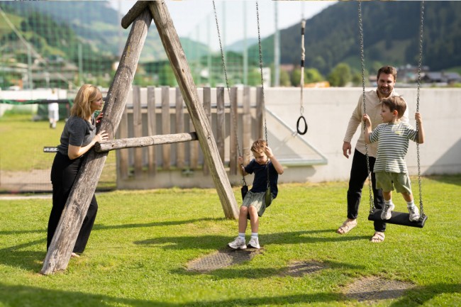 Children's playground with climbing structures and swings